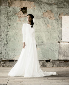 LEFT: Model Centria Kapris The Pia Dress from Edith Elan, $2,655 Earrings by Head Candi, $28 Headpiece by Head Candi, $112