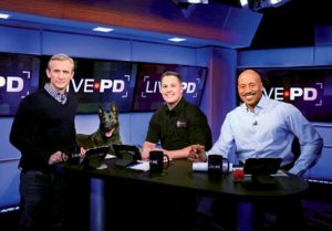 Sgt. Denver Leverett (middle) with “Live PD” host Dan Abrams (left) and analyst Tom Morris Jr.
