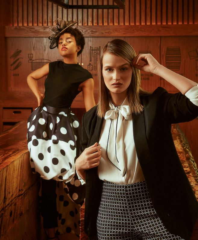 Shantay in CQ by CQ Polka Dot Dress from Sapphire on Spring $78 / Black Fascinator from Ben Franklin $59.95 / Eric Casual Pants from Strandz and Threadz $49 Katya in Print Eric Casual Pants from Strandz and Threadz $49 / Bow Tie Blouse from Mariposa