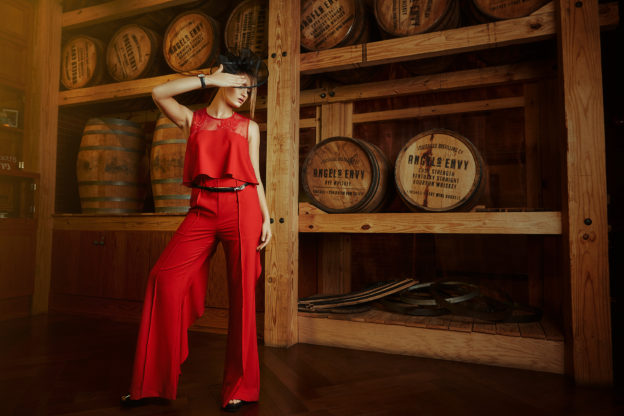 Katya in Strut & Bolt Red Jumpsuit from Sapphire on Spring $64 / Black Fascinator from Ben Franklin $49.99