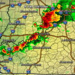 Radar image at 8 PM Tuesday showing a line of strong thunderstorms from Evansville through Louisville toward Cincinnati, with red/orange areas indicating heavy rainfall.