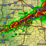 Radar map at 3 AM showing a line of strong thunderstorms stretching from Evansville through Louisville toward Cincinnati, with red and purple areas indicating heavy rainfall/possible hail and green-yellow areas lighter rain across Kentucky, Indiana, and Ohio.