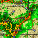 Doppler radar map showing widespread rain and thunderstorms across Kentucky and southern Indiana, with a strong line of storms near Louisville.