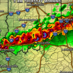 Weather radar map showing a line of strong thunderstorms across southern Indiana into Kentucky, with red and purple indicating heavy rain and possible hail near Evansville, Louisville, and Cincinnati; green areas show lighter rain.