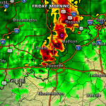 Radar map showing a line of strong thunderstorms around Louisville, with red/purple areas indicating heavy rain and possible hail; green areas are lighter rain.