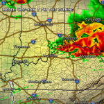 Radar map showing heavy storms east of Louisville and Covington, with red/yellow areas and green surrounding lighter rain. Mostly clear west of Louisville.
